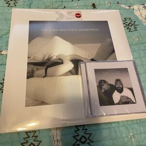 The Tortured Poet’s Department vinyl and Fortnight Limited Edition CD.